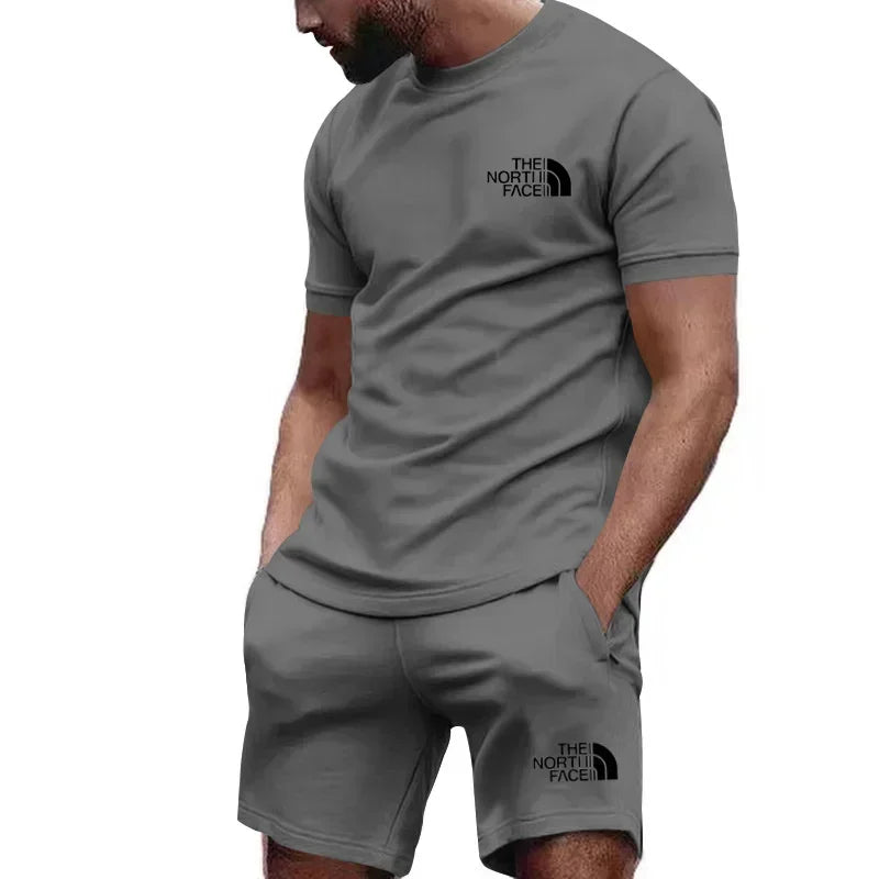 طقم رجالي رياضي كاجوال، مكون من تيشيرت بأكمام قصيرة وشورت للجري. تصميم صيفي جديد، متعدد الألوان وجيد التهوية، ومكون من قطعتين